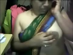 For the camera, a fat Indian milf shows off her booty and zeppelins.